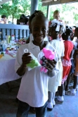 child receiving a Christmas gift