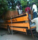 A bus adapted to carry people and supplies are providing transport