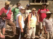 Field Director Rosemond Pierre with team members at water well and purification system in Bayonnais